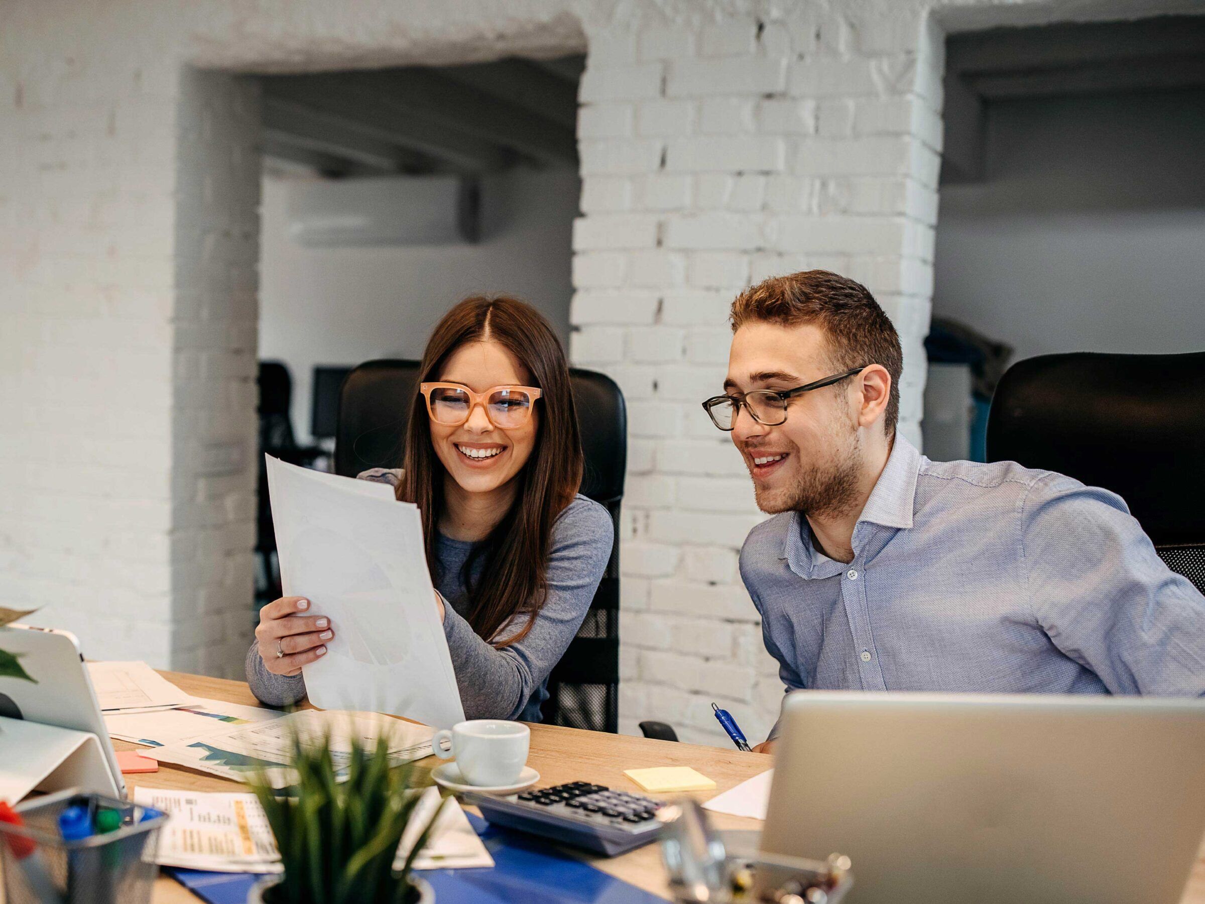 Employees reviewing their 30-60-90 Plan for New Employee Onboarding