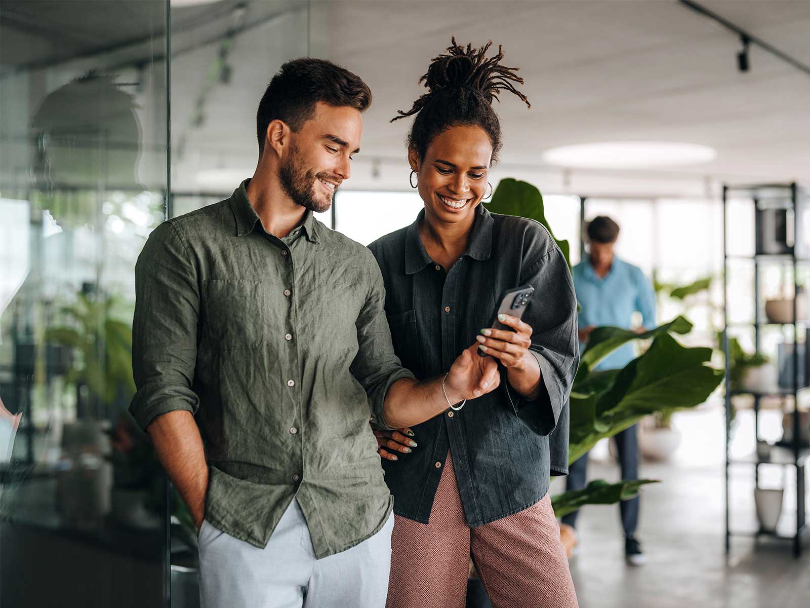 Employees looking at an employee survey on their phone