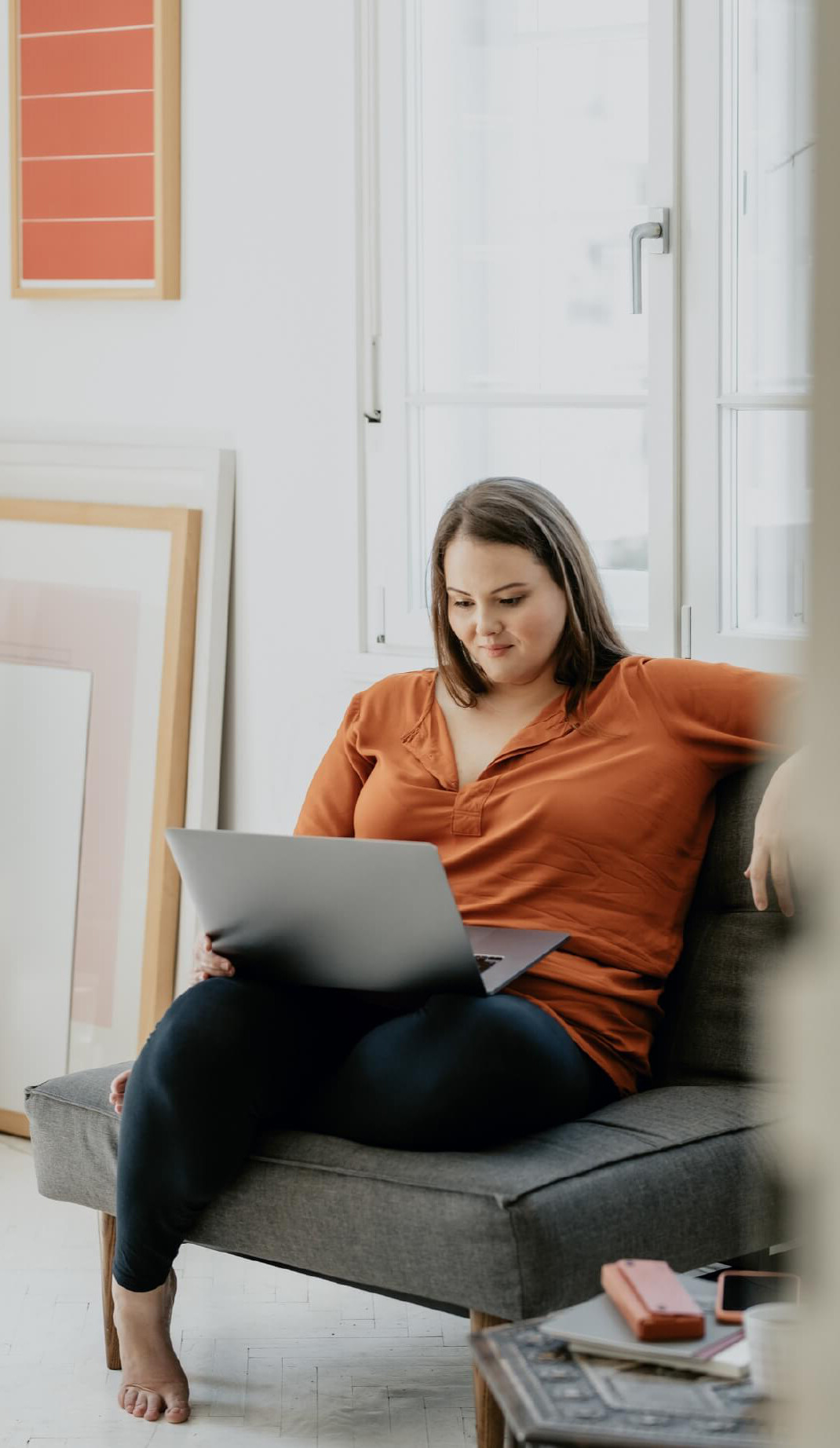 woman looking at health coaching programs on her laptop