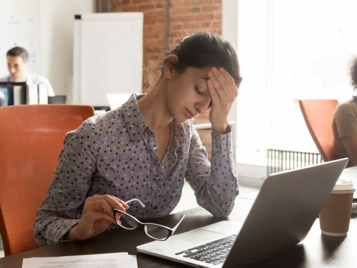 burned out female employee at her desk