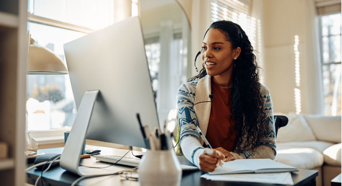 Woman researching on her computer how to improve employee engagement