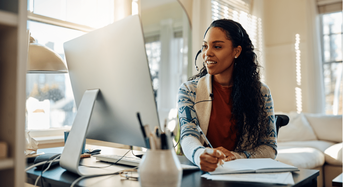Woman researching on her computer how to improve employee engagement