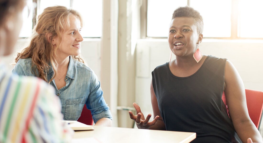 Women discussing menopause in the workplace
