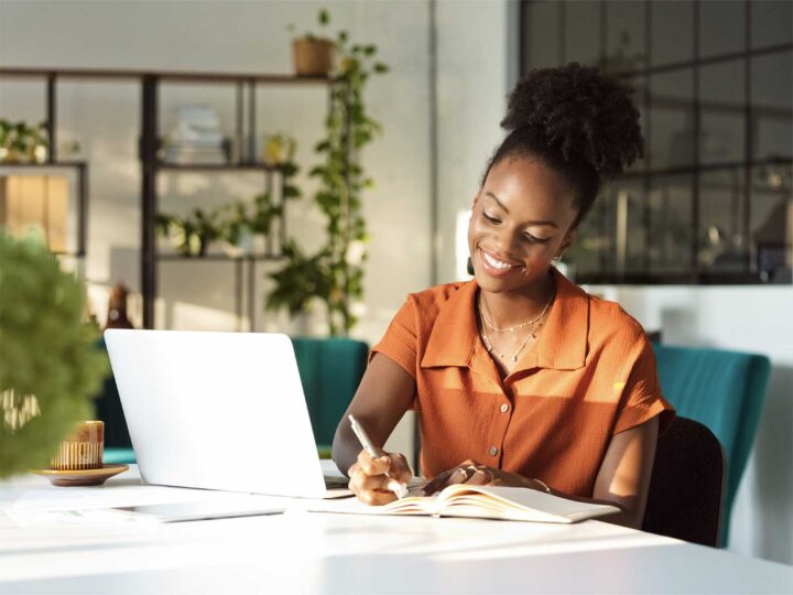 Woman reviewing mental health resources on her computer