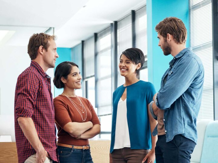 employees discussing how to get leadership support and buy-in for employee well-being