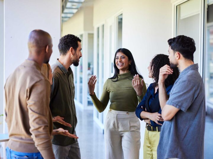 a group of employees discussing 2026 workplace well-being trends