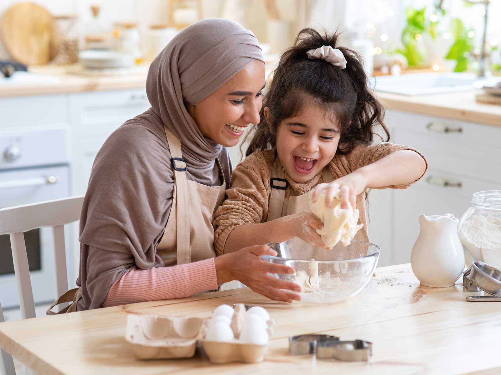 mom making cookies with her daughter
