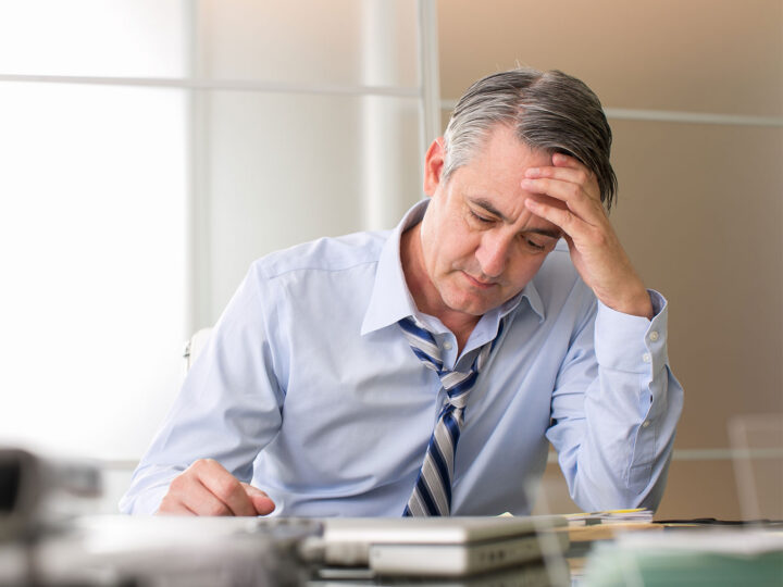 male employee stressed at work