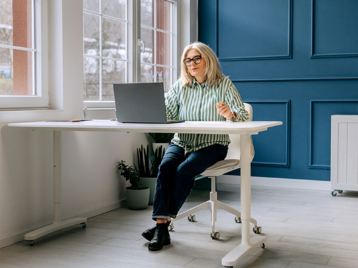 older female employee at her desk
